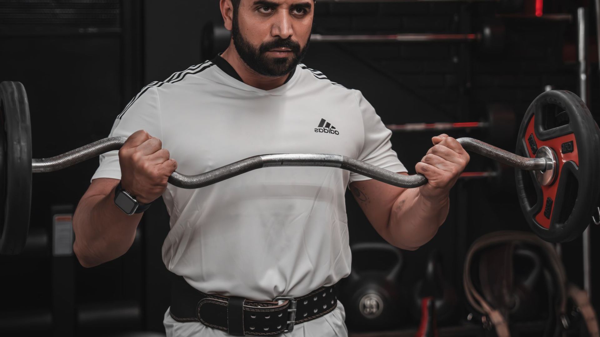 Member training with a barbell at Fit 4 U Gym Sharjah